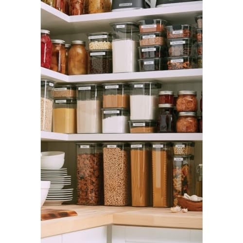 Clear plastic containers with white lids, designed for pantry organization, are variously filled with dry goods such as pasta, grains, and preserved foods.