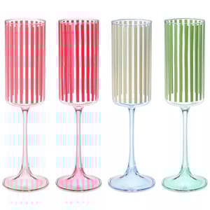 Four champagne flutes with vertical stripes in red, pink, beige, and green on clear stems.