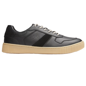 A black leather sneaker with a beige rubber sole, featuring white laces and a subtle black stripe detail on the side.