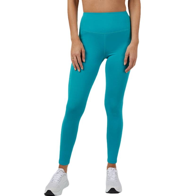 A person is wearing high-waisted, turquoise leggings paired with white sneakers.