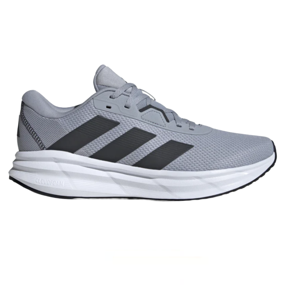 A gray running shoe with black stripes, featuring a Cloudfoam midsole for cushioning.