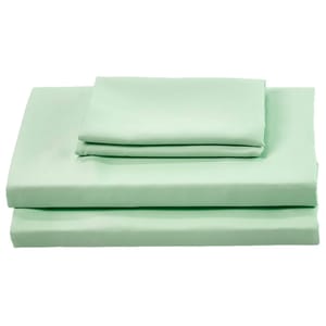 A neatly folded set of mint green bed sheets, including a fitted sheet, a flat sheet, and pillowcases.