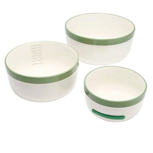 Three white and green plastic food storage bowls with measurement markings on the inside and a vent on the side for easy microwaving.