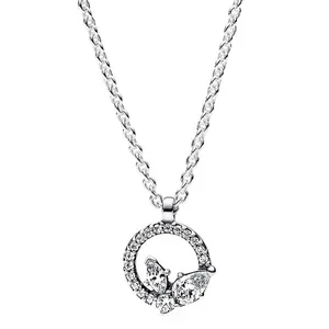 A silver chain necklace featuring a circular pendant encrusted with small crystals, adorned with butterfly-like crystal accents.