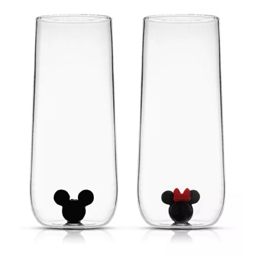 Set of two tall clear glasses with black mouse ear designs at the base; one with a red bow.