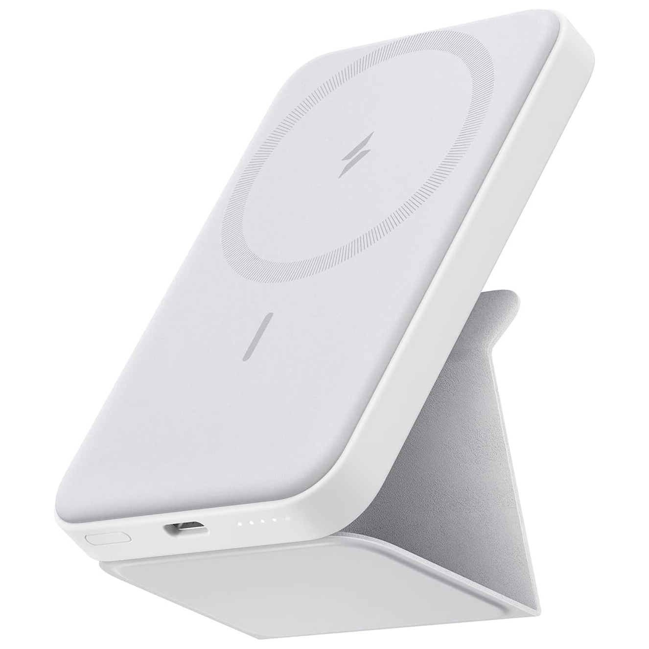 A white wireless charging power bank with a foldable stand, featuring a circle design with a lightning bolt symbol and LED indicator lights.