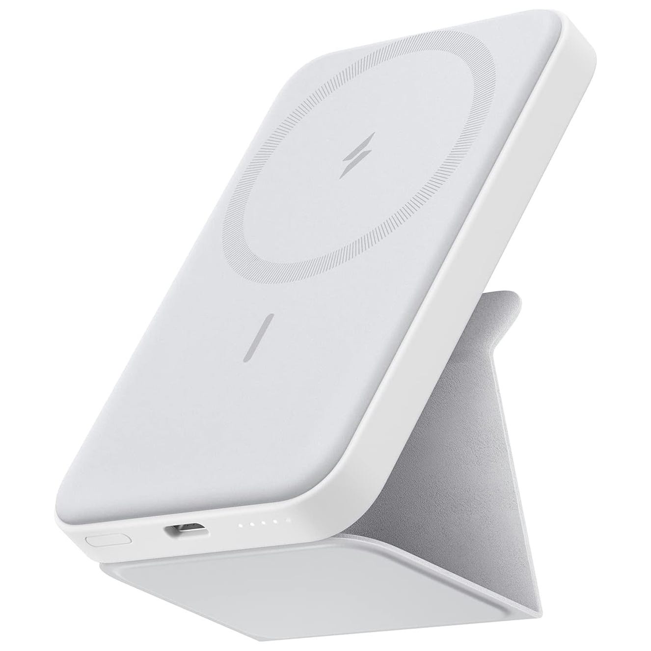 A white wireless charging power bank with a foldable stand, featuring a circle design with a lightning bolt symbol and LED indicator lights.