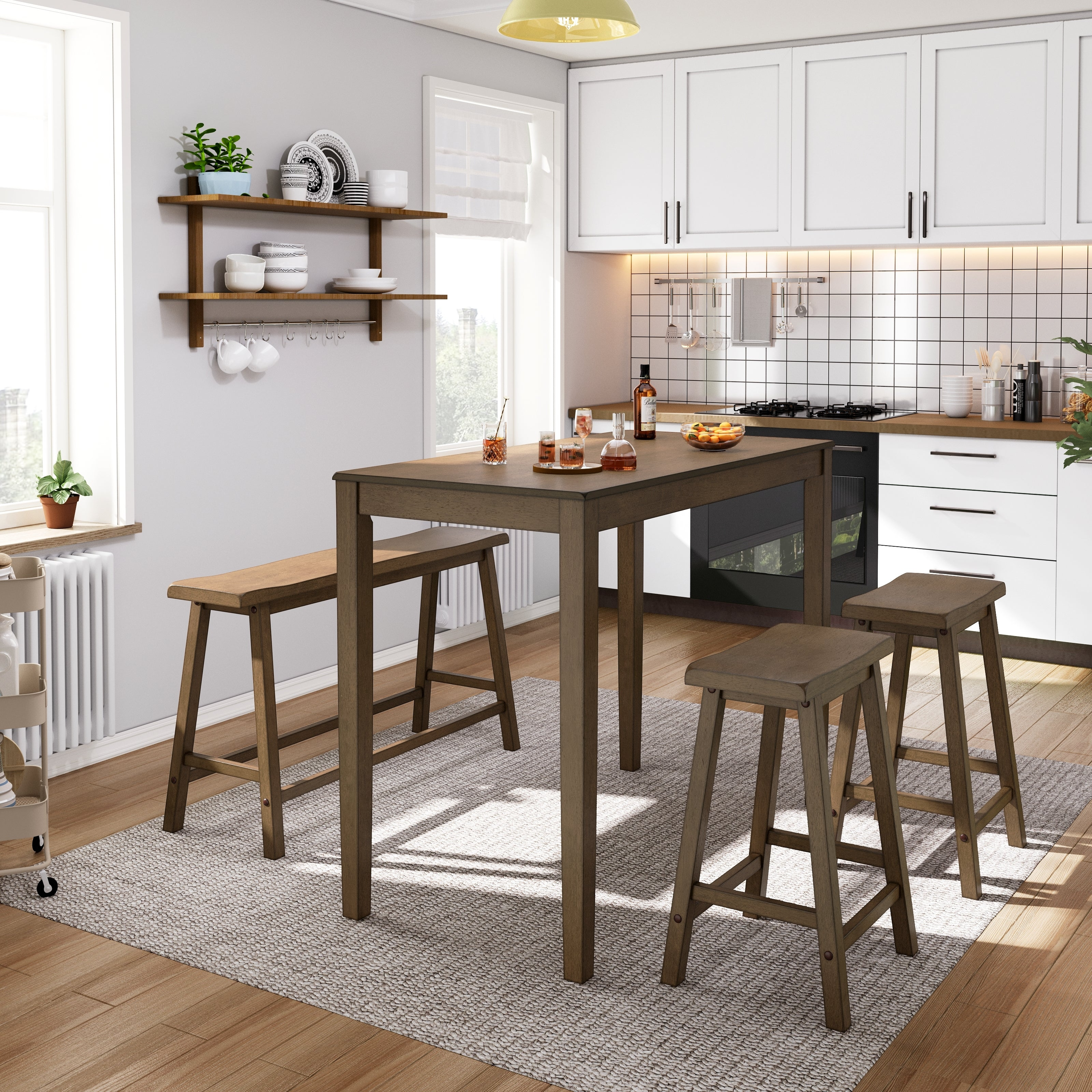A modern kitchen with a tall wooden dining table and stools on a light gray rug. Wall-mounted shelves hold dishes, and white cabinets with black handles are above a stove and oven. A small cart holds plants by a window.