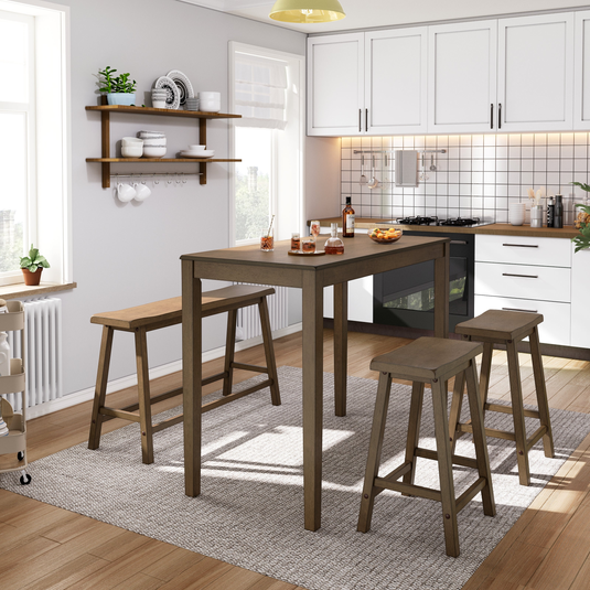 A modern kitchen with a tall wooden dining table and stools on a light gray rug. Wall-mounted shelves hold dishes, and white cabinets with black handles are above a stove and oven. A small cart holds plants by a window.