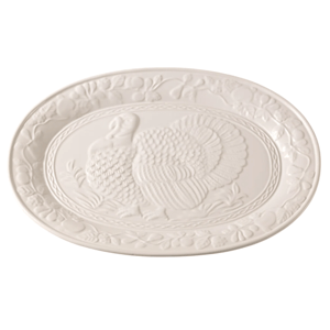 White ceramic platter featuring an embossed turkey design with a decorative fruit border.