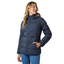A woman is wearing a navy puffer jacket with a front zipper and side pockets, paired with blue jeans.