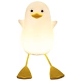 A cute penguin-shaped night light with yellow feet and a yellow beak, featuring a white glowing body.