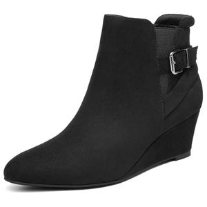 A black wedge ankle boot with a buckle strap detail and a rounded toe.