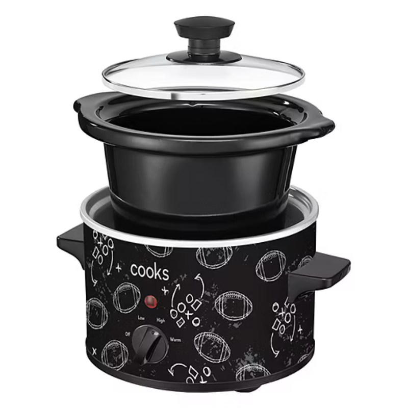A slow cooker with a football-themed design, featuring a black exterior, glass lid, and control dial with settings for low, high, and warm.
