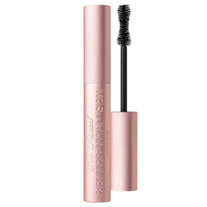 Too Faced Better Than Sex mascara in a light pink tube with an open, hourglass-shaped brush.