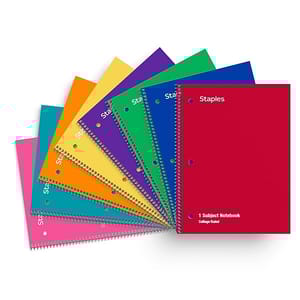 Staples 1-Subject Spiral Notebooks are displayed in a range of vibrant colors, featuring college-ruled pages and a durable spiral binding. Each notebook has perforated pages and two holes punched for easy organization.